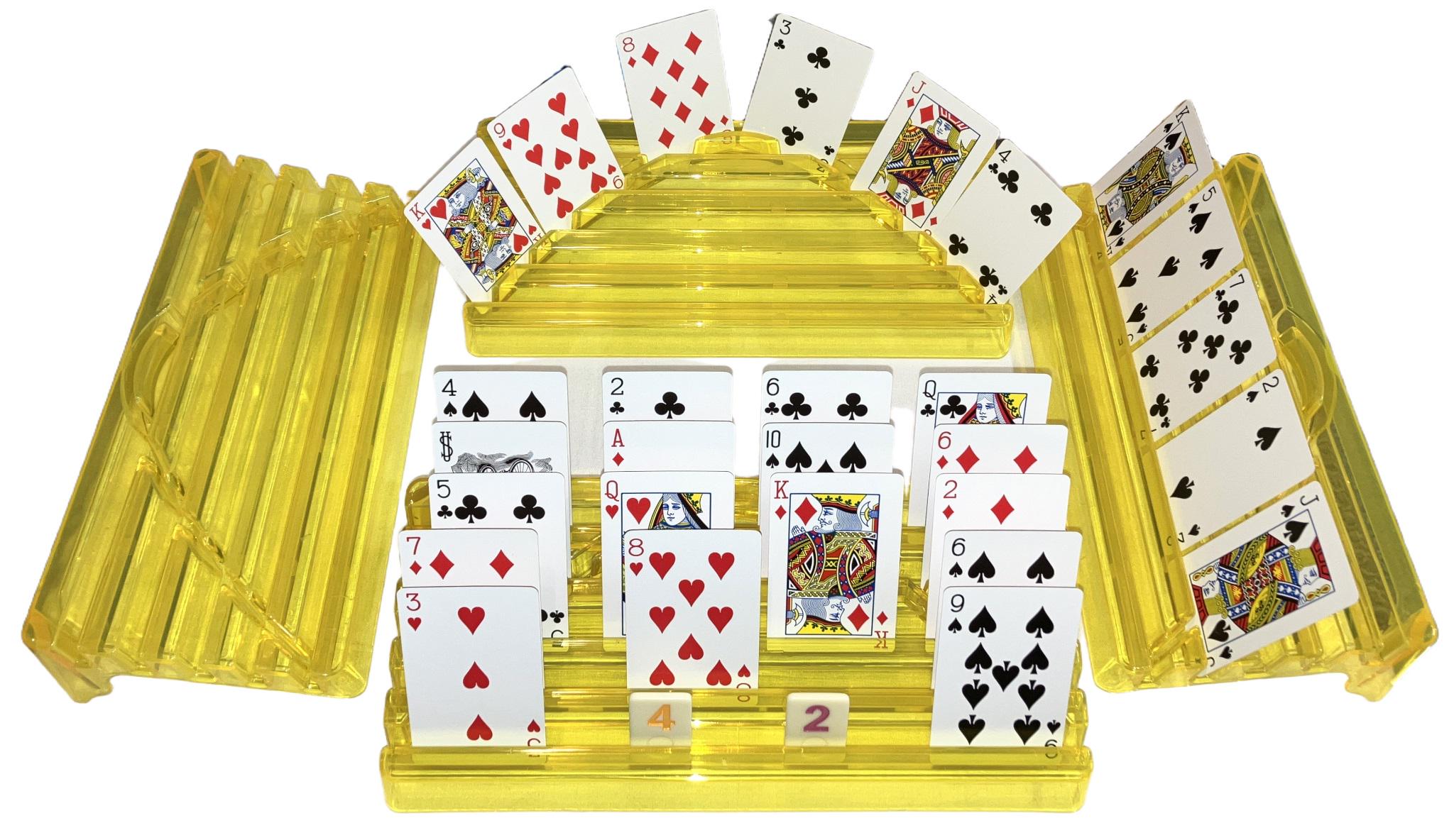 Four yellow plastic playing card racks